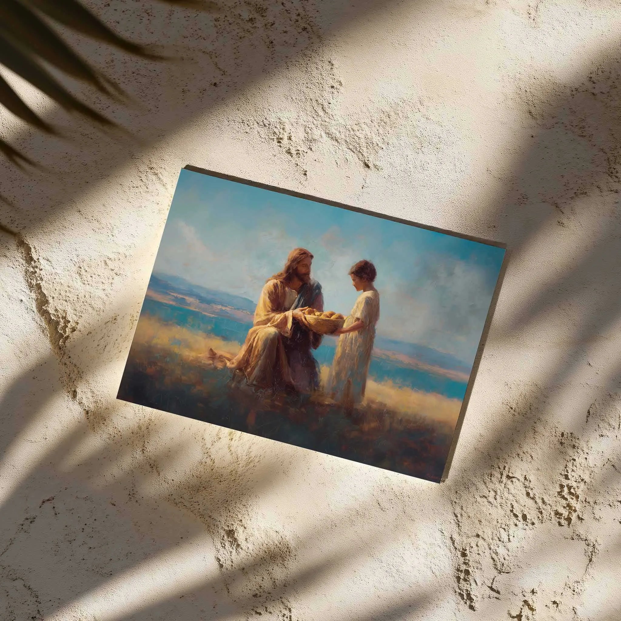 Christian wall art print of Jesus and the boy with loaves and fishes displayed on textured beige wall – faith based home decor canvas artwork.