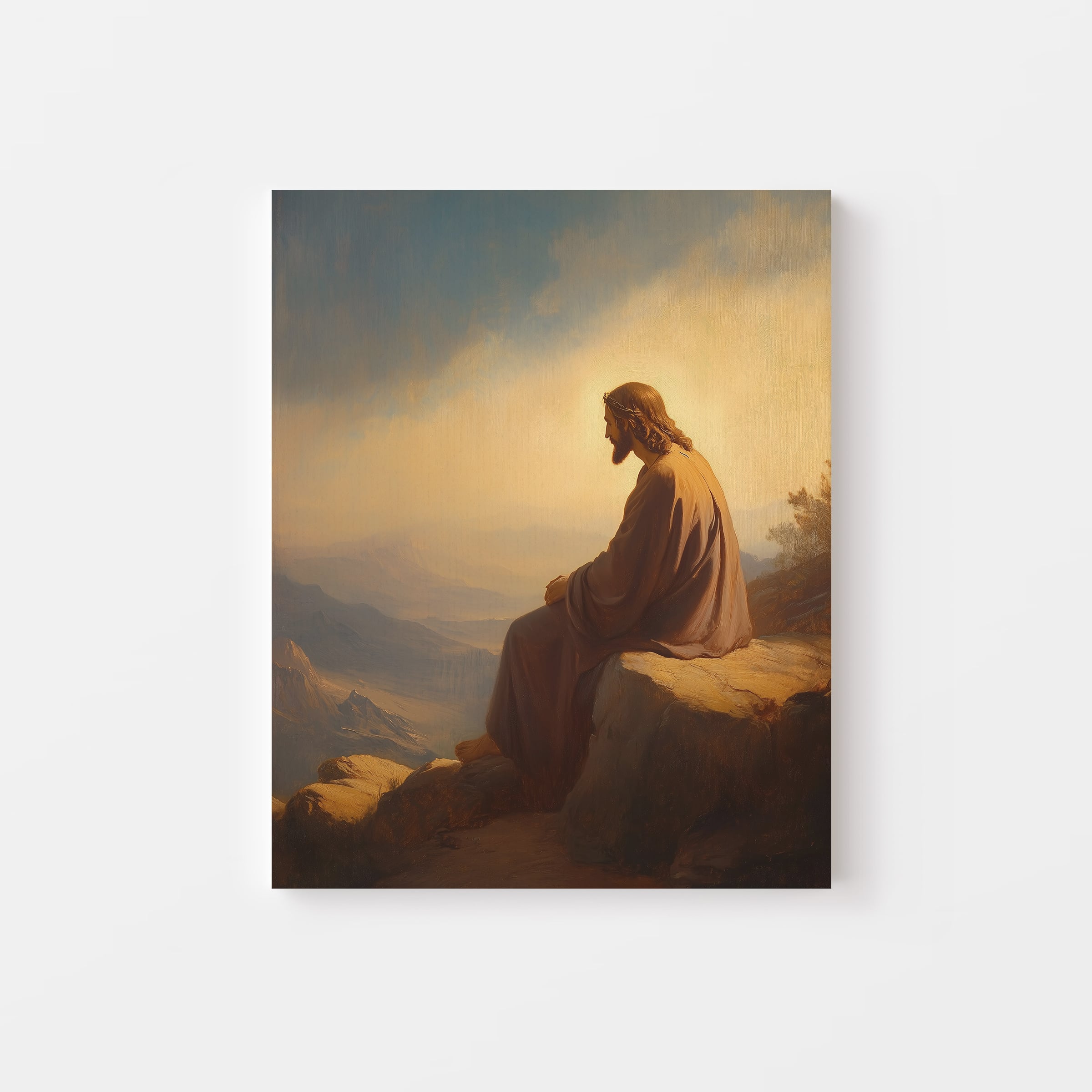 Peaceful portrait of Jesus sitting on a rock – Christian canvas art representing reflection and grace